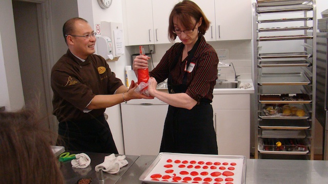 Piping macarons at Bonnie Gordon 