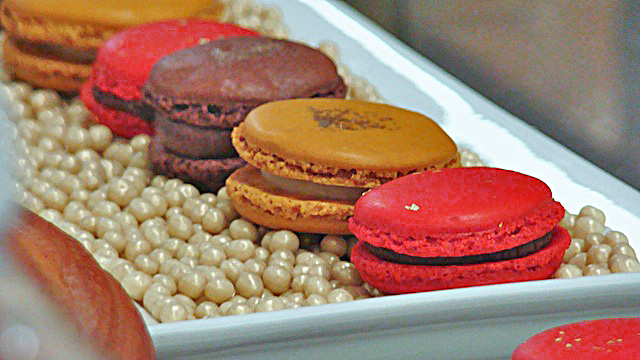 A variety of macarons on chocolate pearls