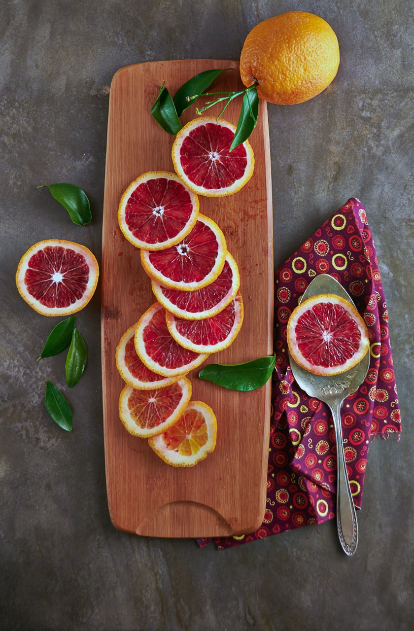 Rings of blood oranges slices to show the contrast of skin and fruit. By The Messy Baker.