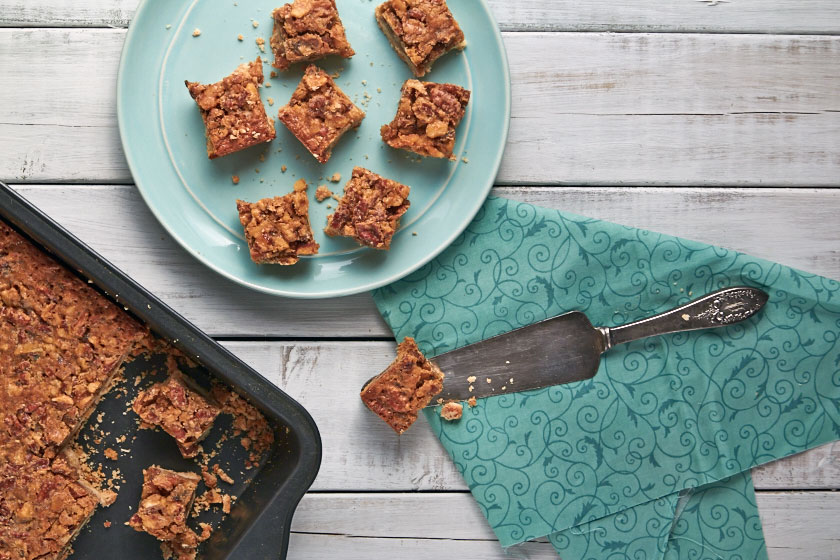 Maple Nut Squares are topped with a mix of nuts and maple syrup.