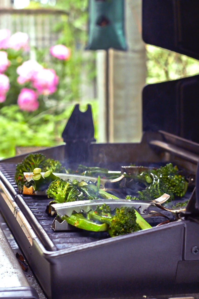 Spicy Grilled Broccolini held in place with veggie clips. 