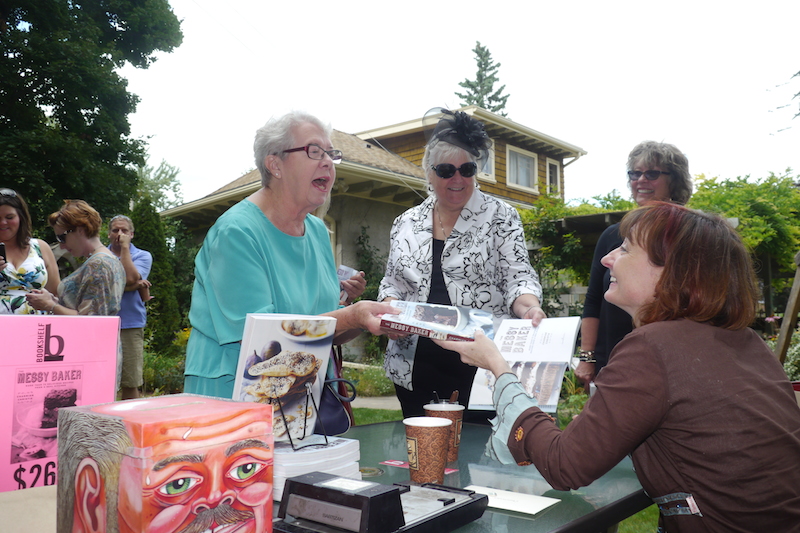 Rose Murray and Pat Crocker get their copies signed at the Messy Baker book launch.