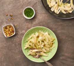 Pan-roasted fennel with pistachios and fennel leaves